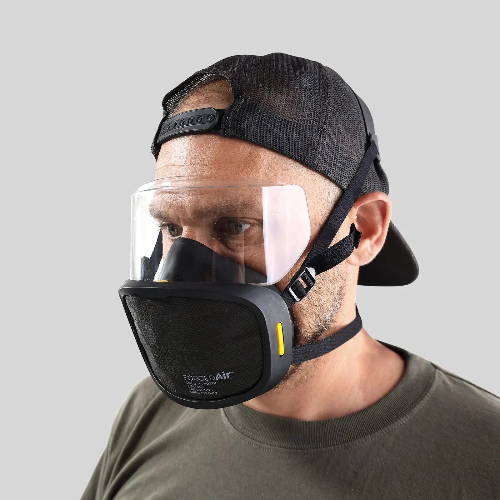 Person wearing a ForcedAir respirator mask with a clear face shield