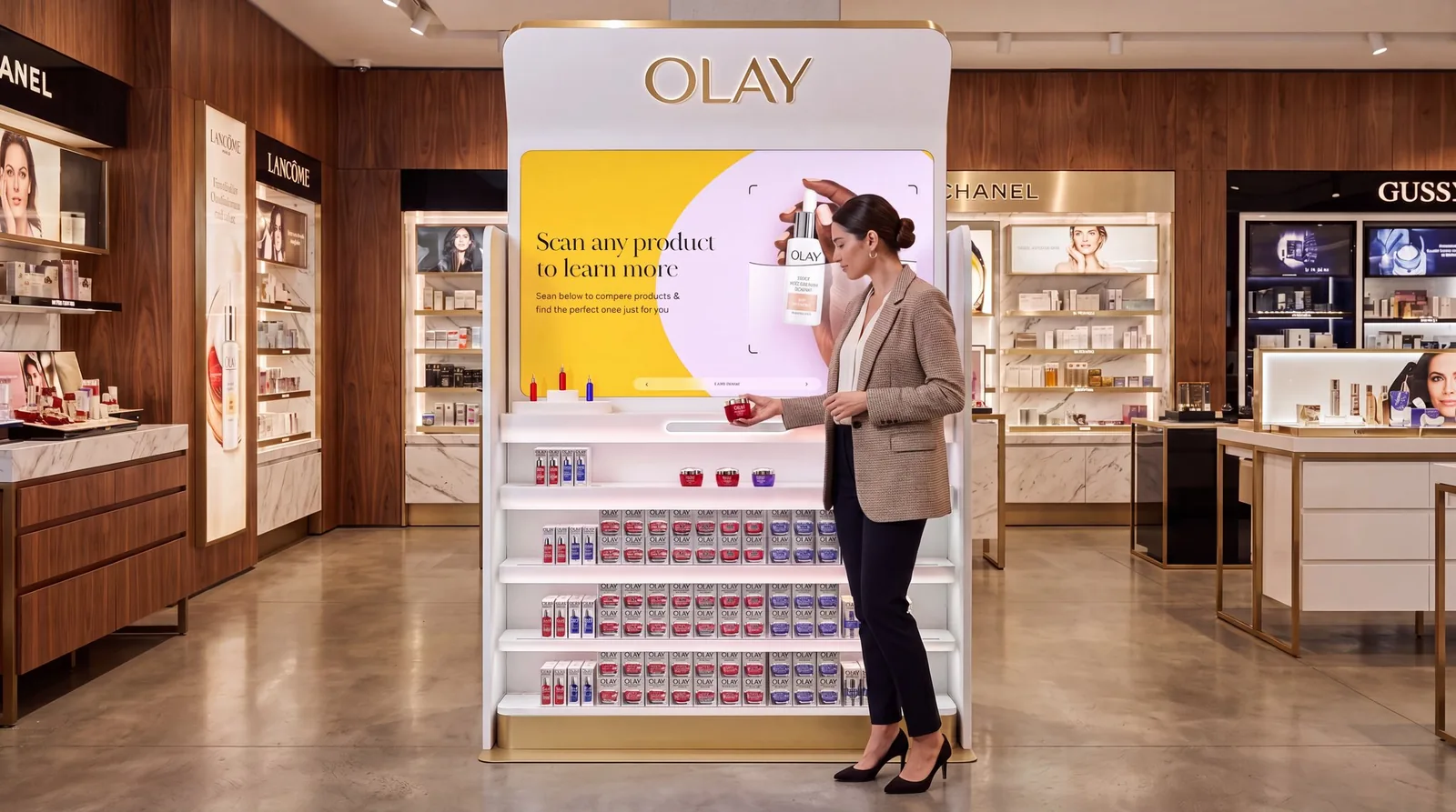 OLAY retail display in a store, with a lit scan-to-learn screen and shelves of product